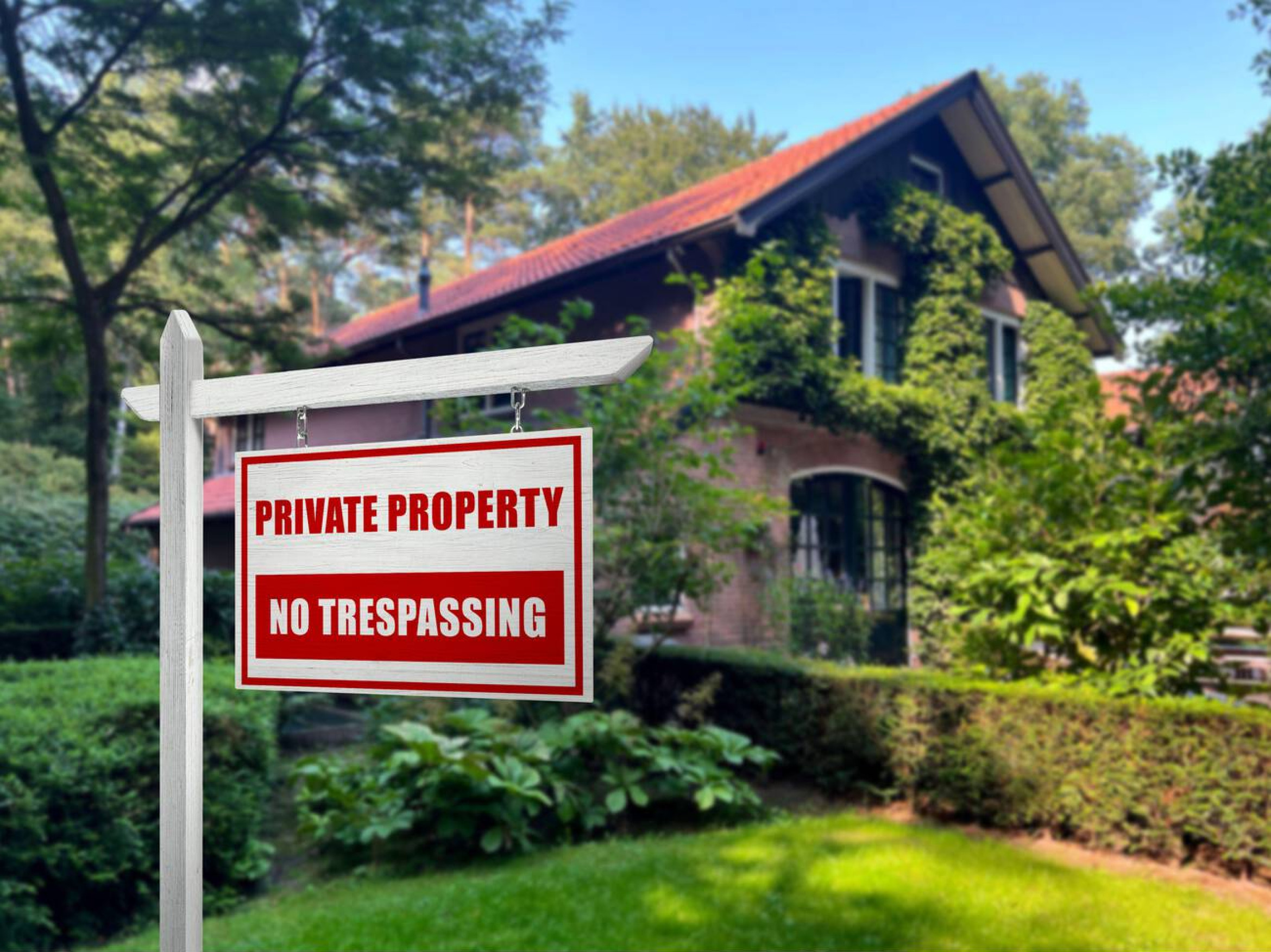Empty property with "No Trespassing" sign