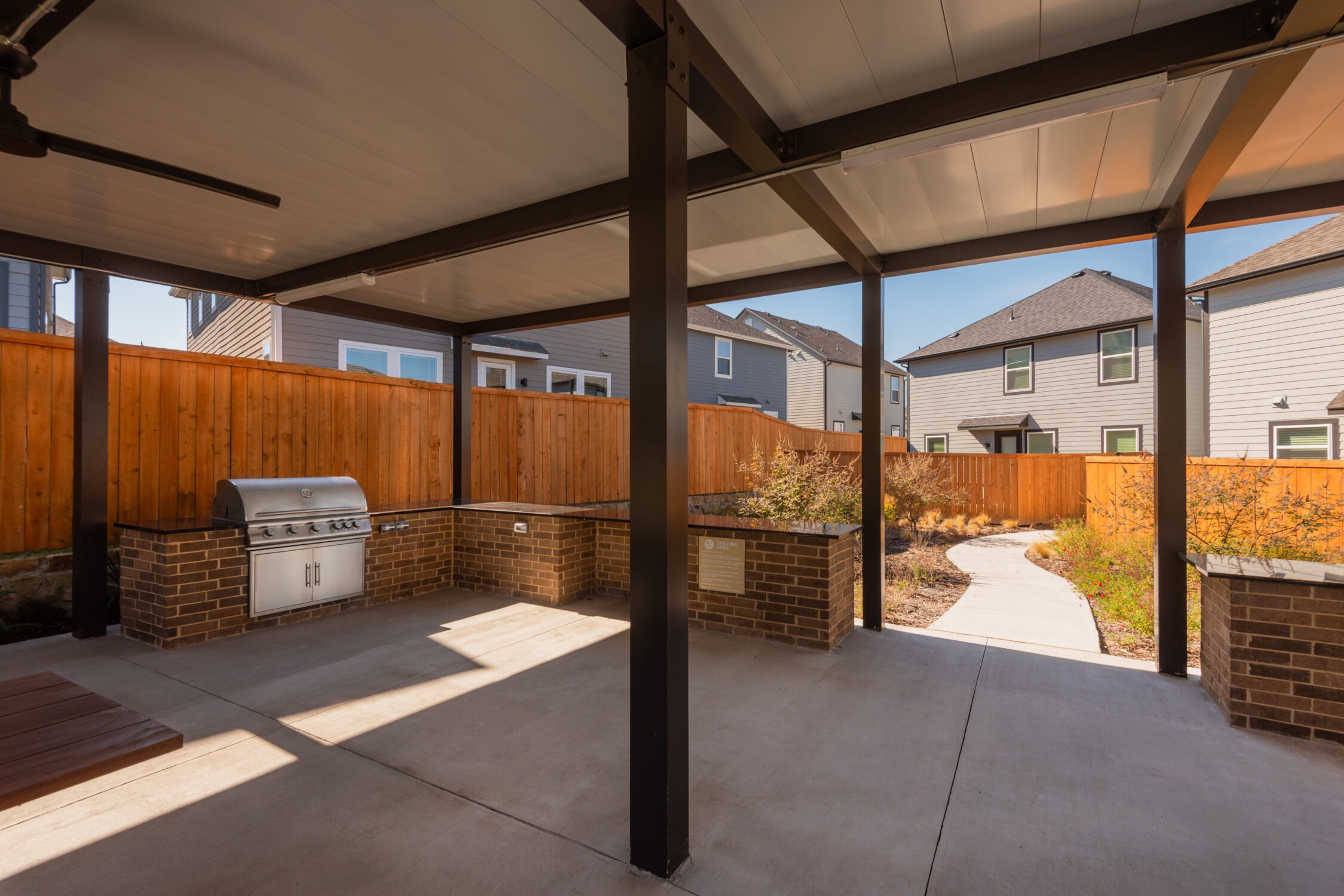 Shaded picnic space with grills and dining