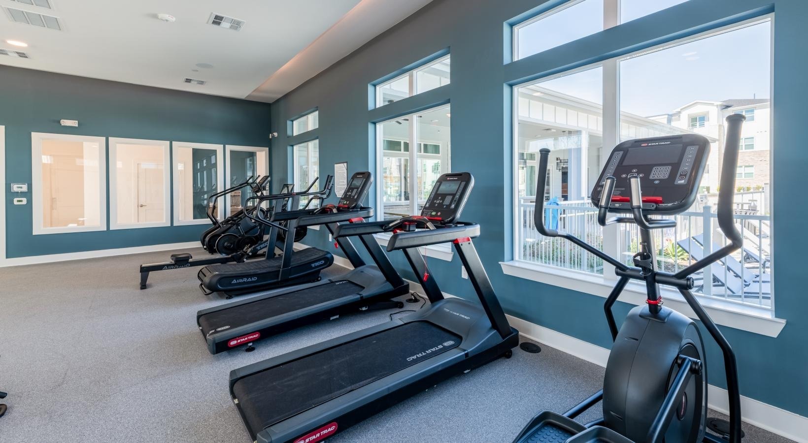 24-hour fitness center with cardio equipment