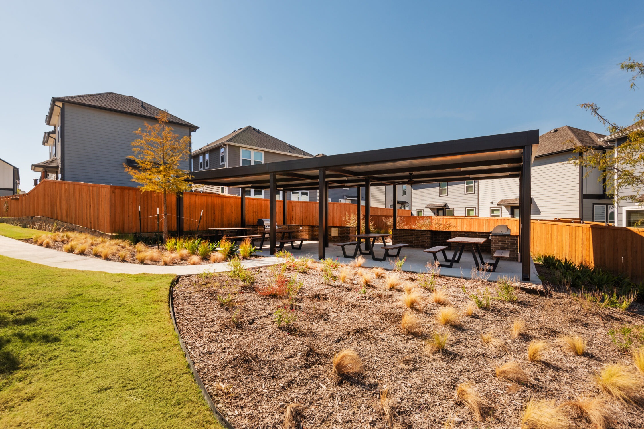 Shaded picnic space with grills and dining