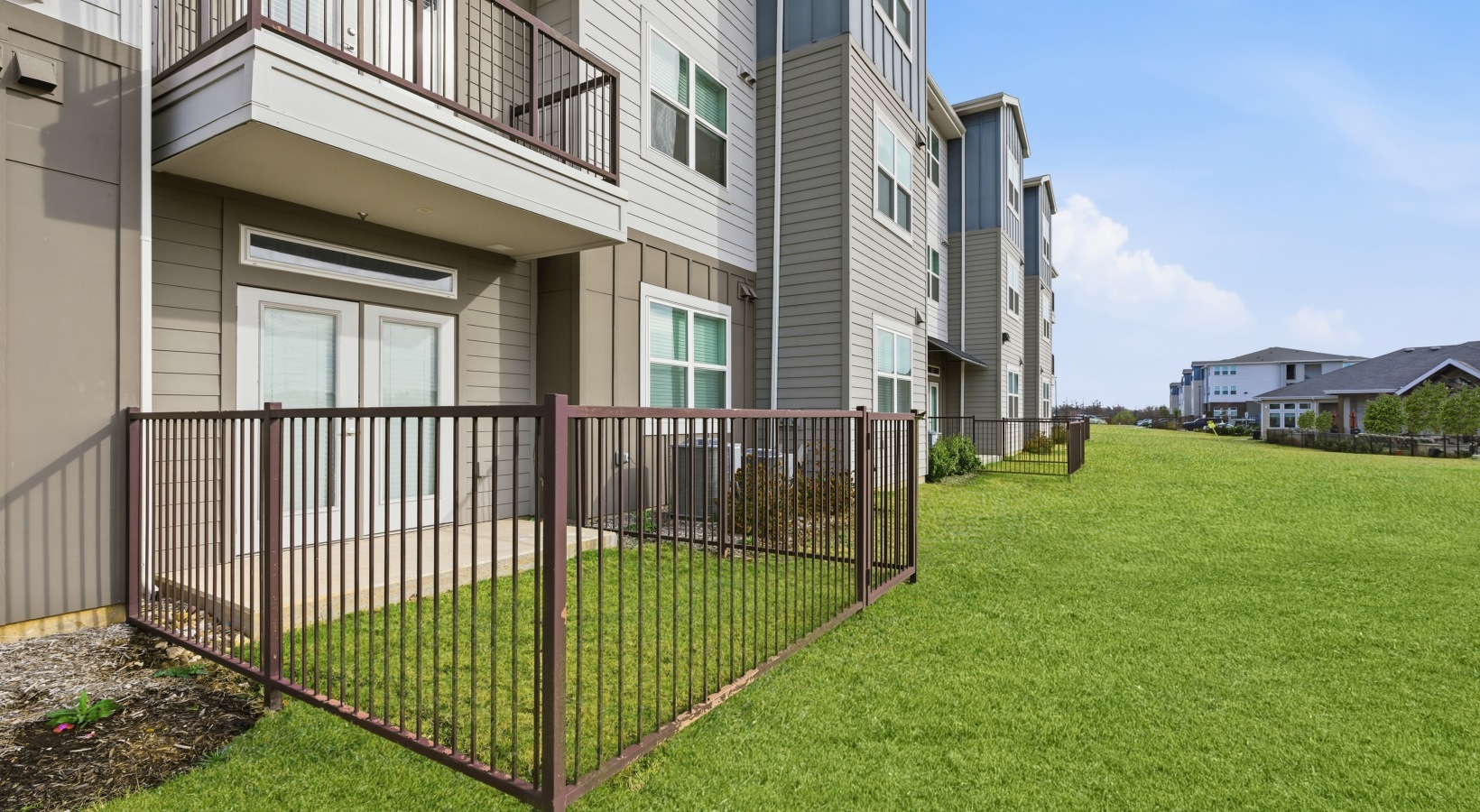 Building exterior with private fenced yards