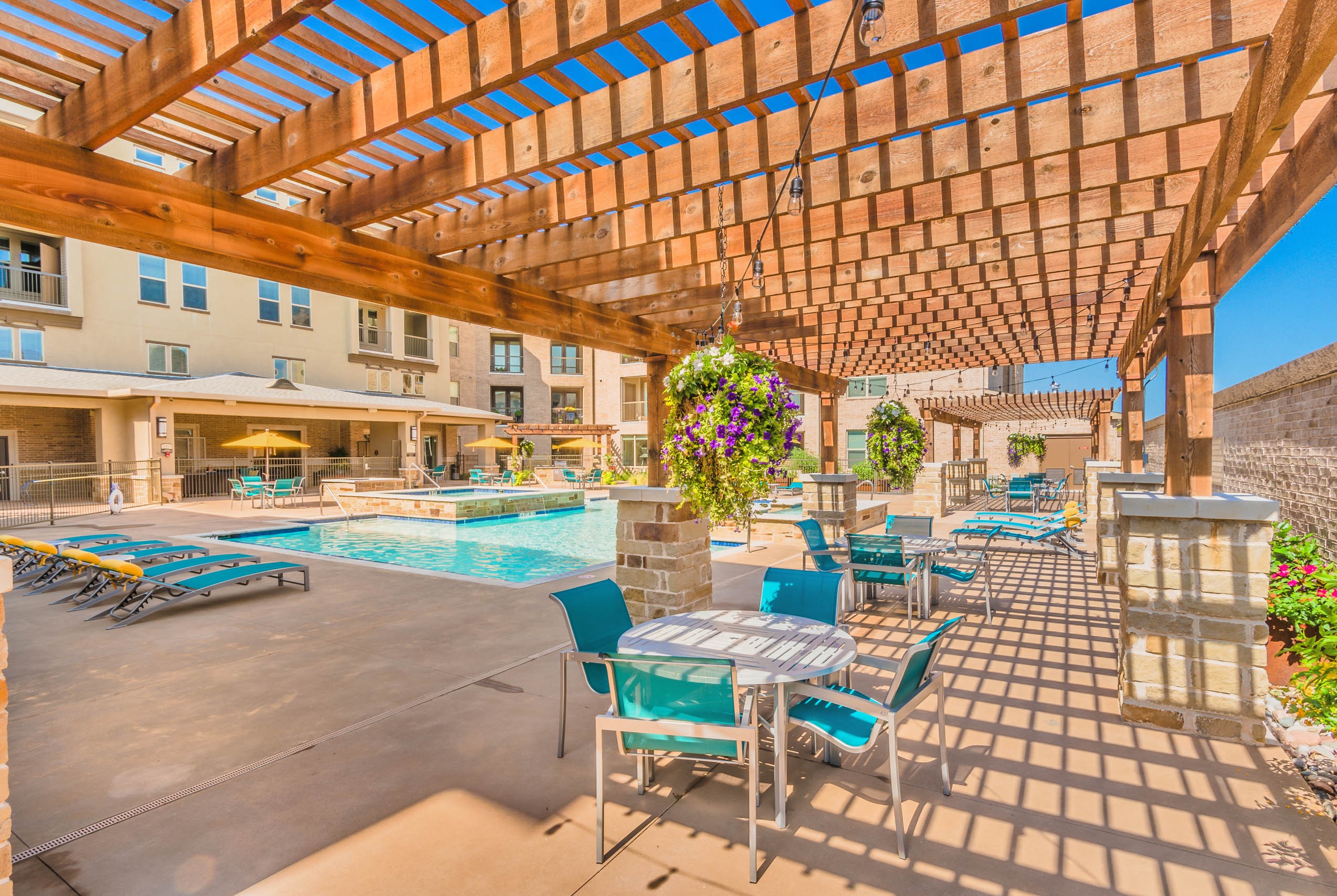 Pergola over poolside seating