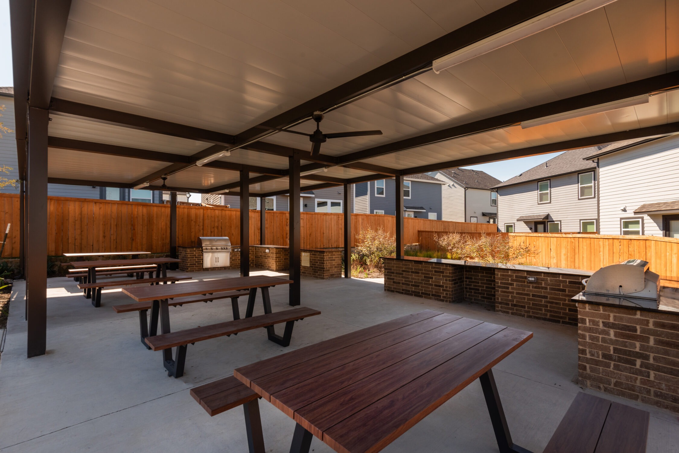 Shaded picnic space with grills and dining