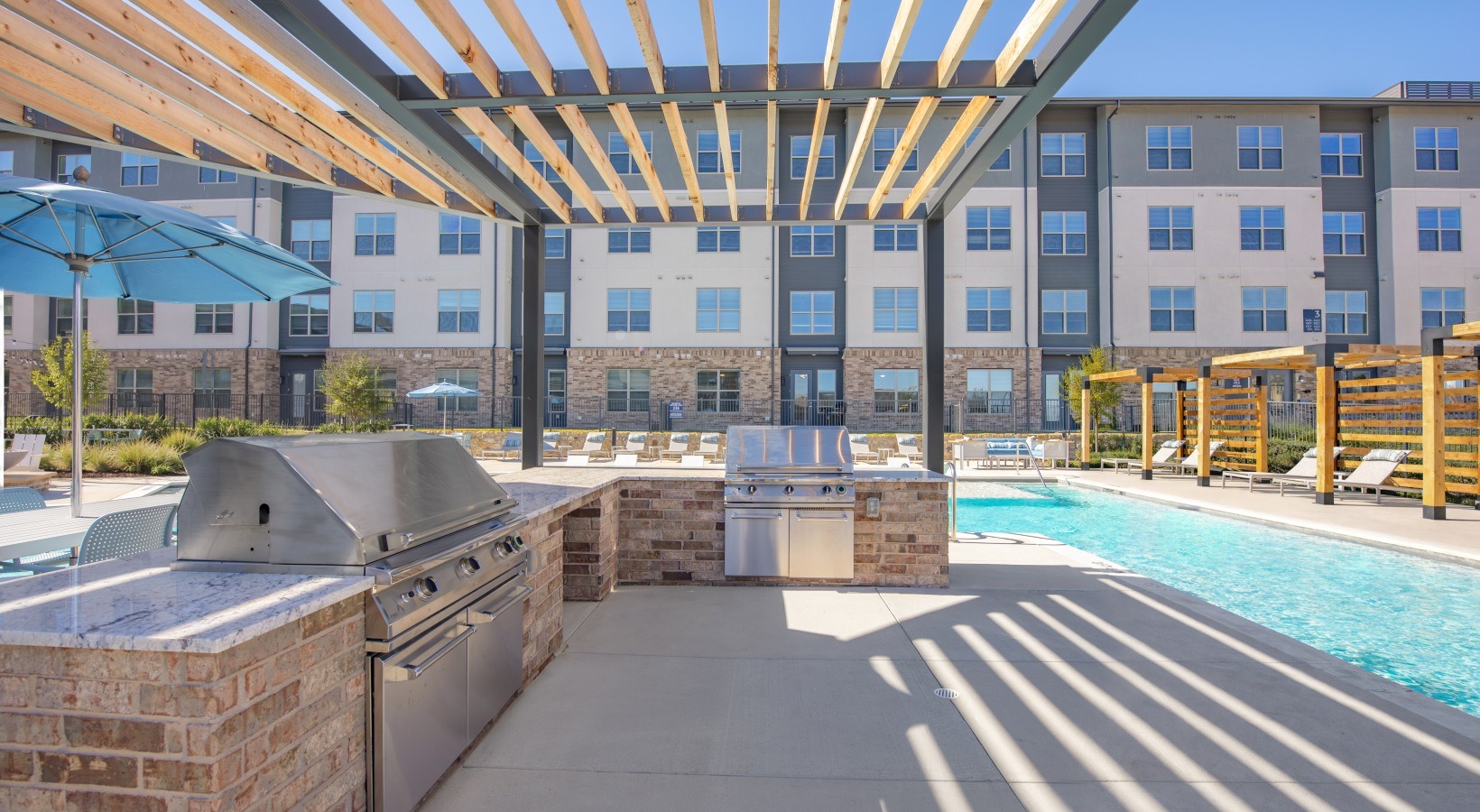 Outdoor kitchen with gas grills