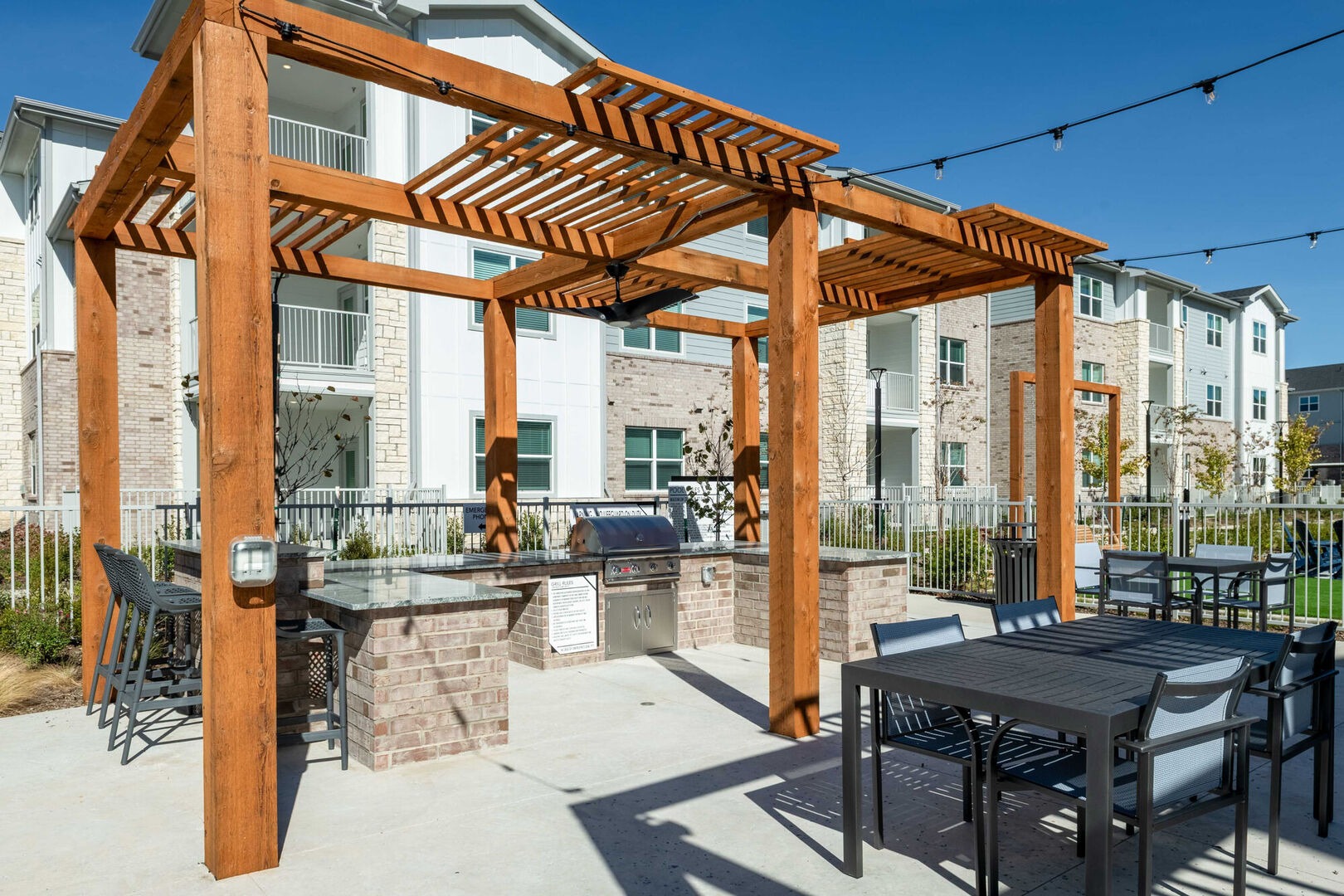 Outdoor grilling pergola and dining