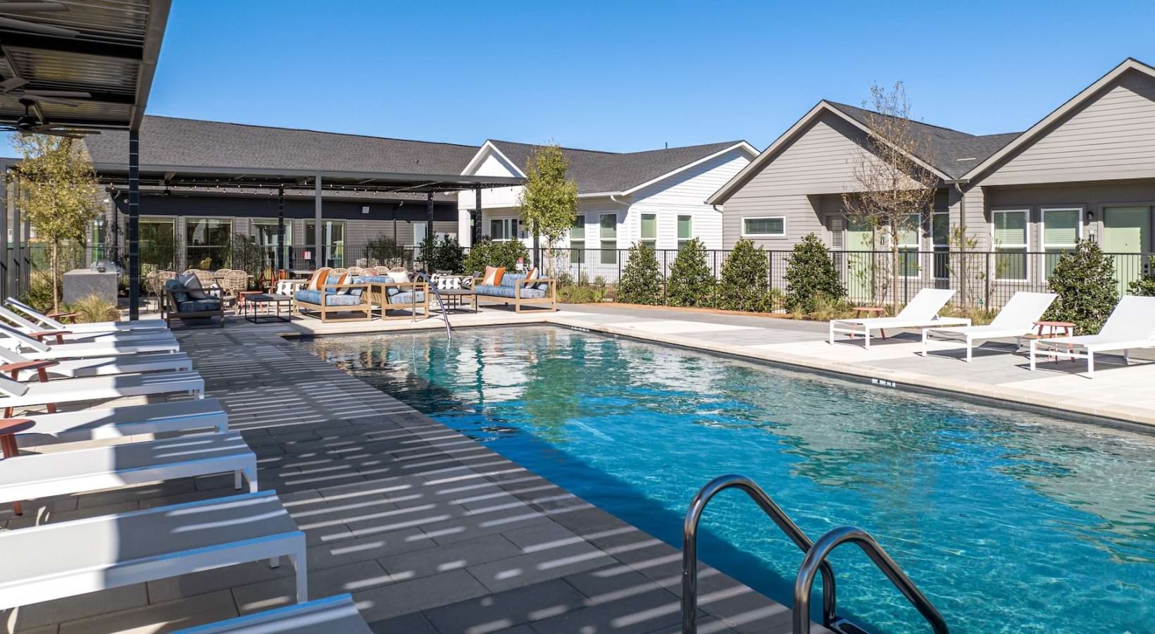 Large pool with deck and lounge chairs