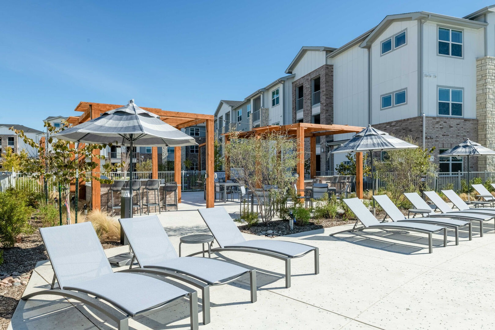Poolside loungers and pergola