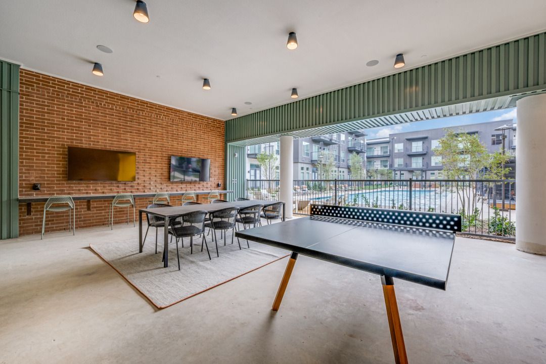 Patio lounge area with gaming table and seating