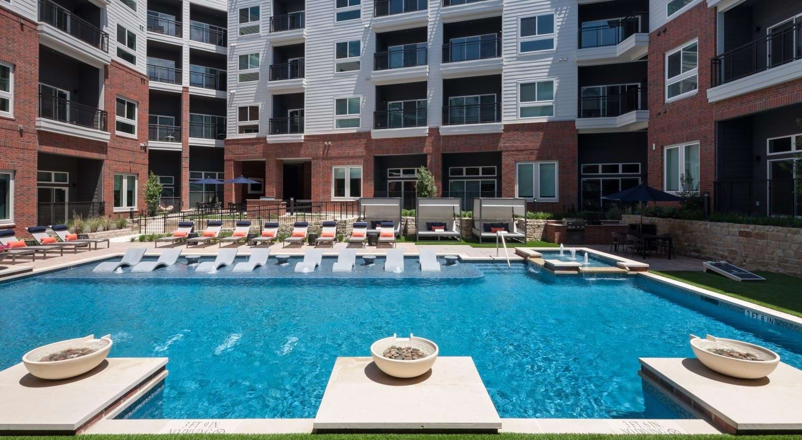 Relax and unwind poolside at Bexford Pullman