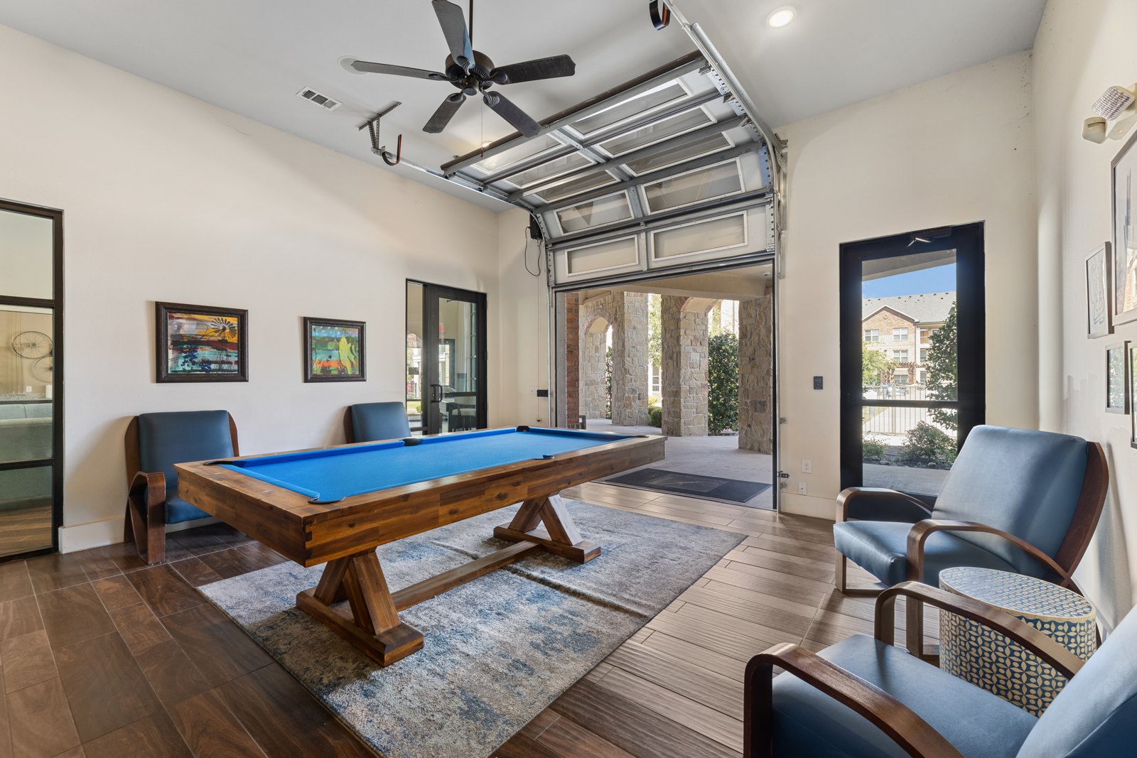 Clubhouse game room with pool table at Auberge of Burleson