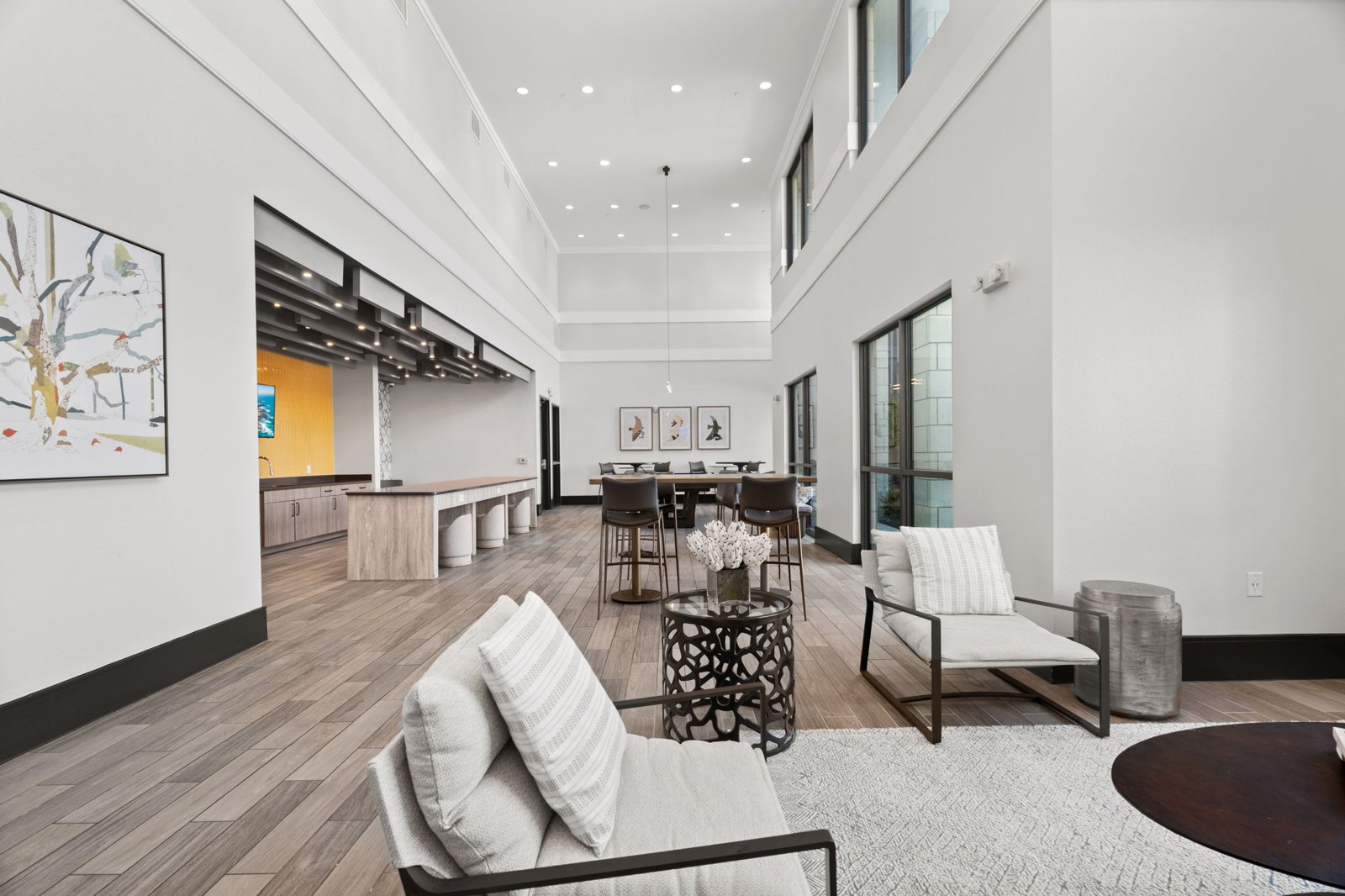 A modern living room with a white couch and a coffee table. at Axis at Watters Creek