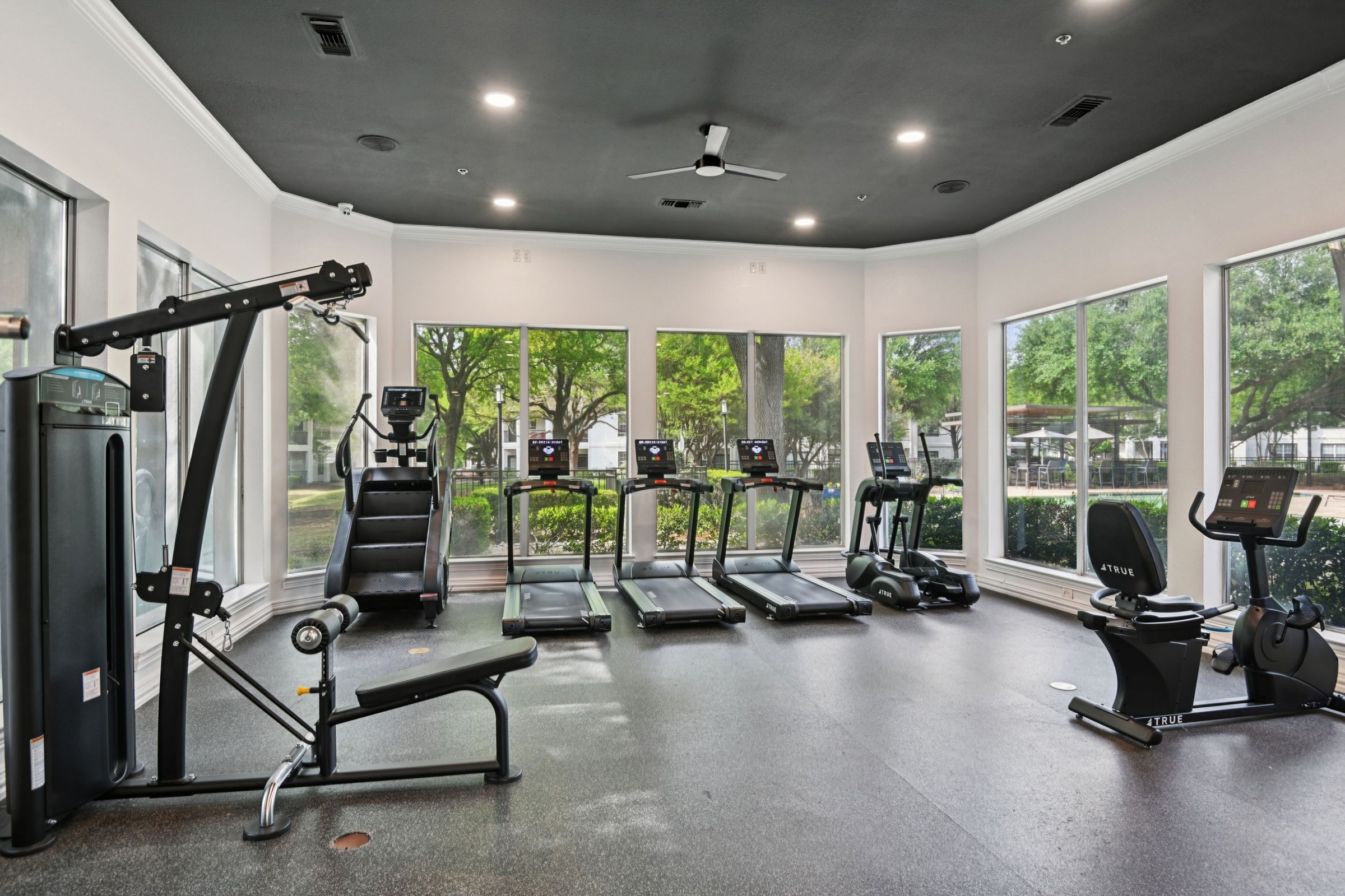 23Hundred at Ridgeview - Bright and spacious gym with various exercise equipment and large windows