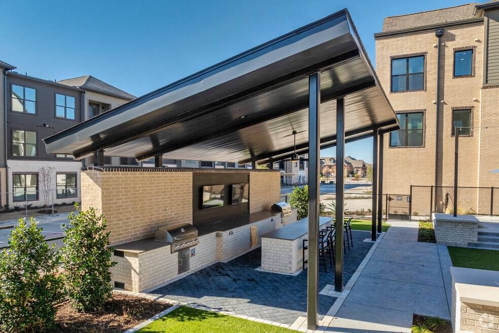 Covered outdoor kitchen with gas grill