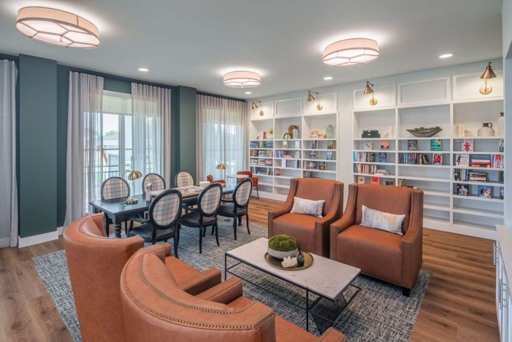 Affinity at Lewisville - Library lounge with bookshelves and seating