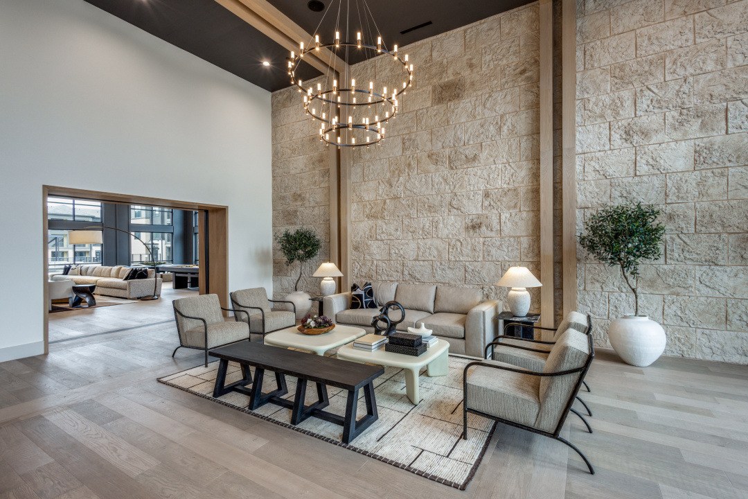 Clubhouse lounge with stone accent wall and chandelier