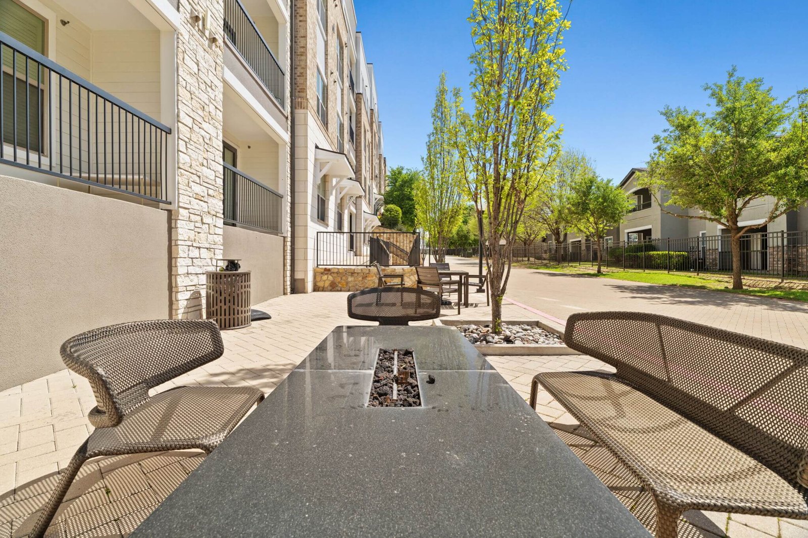 A view of a patio with a table and chairs. at Axis at Watters Creek