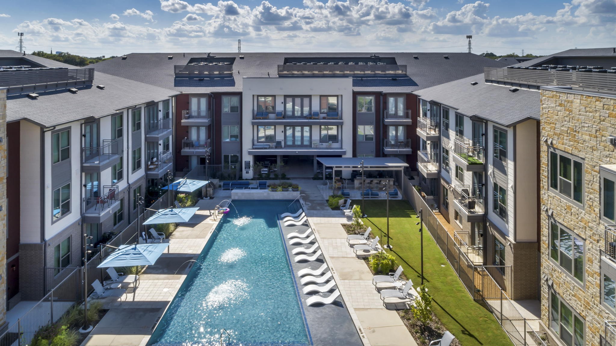 26 at City Point - A swimming pool is surrounded by apartment buildings