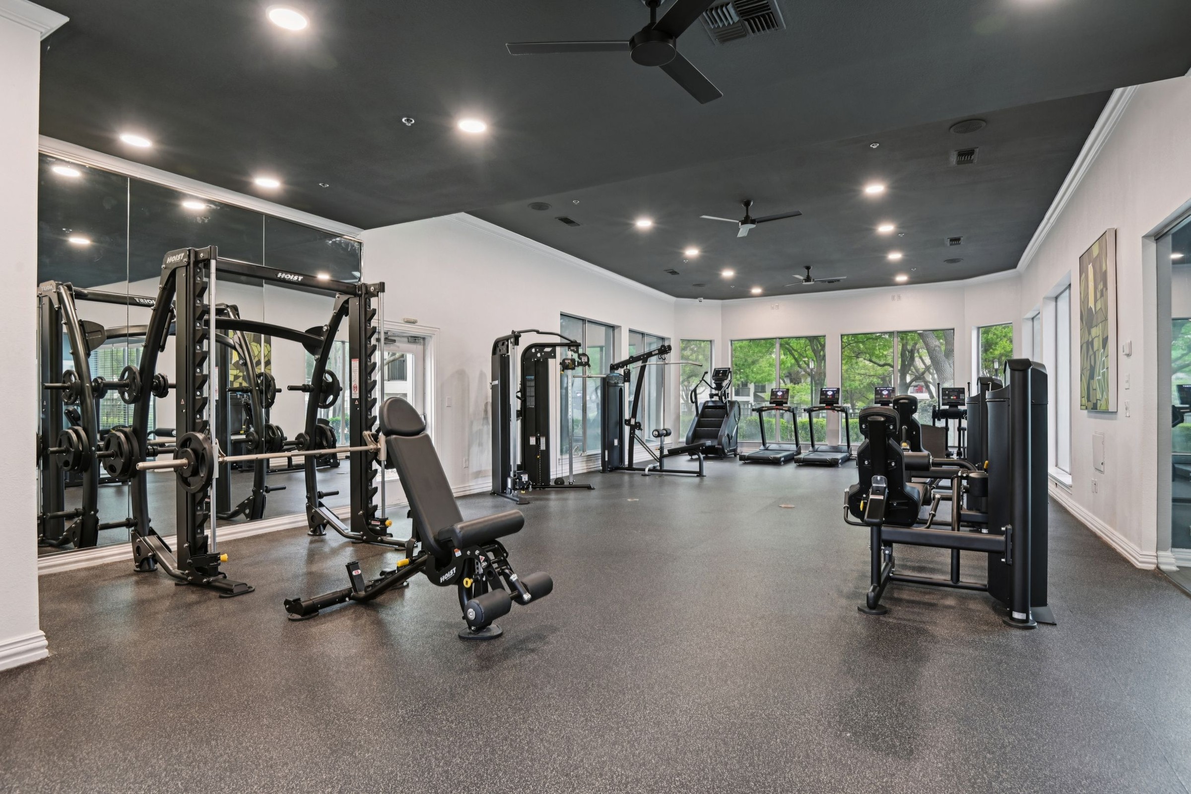 23Hundred at Ridgeview - Modern gym setup with weight machines and cardio equipment