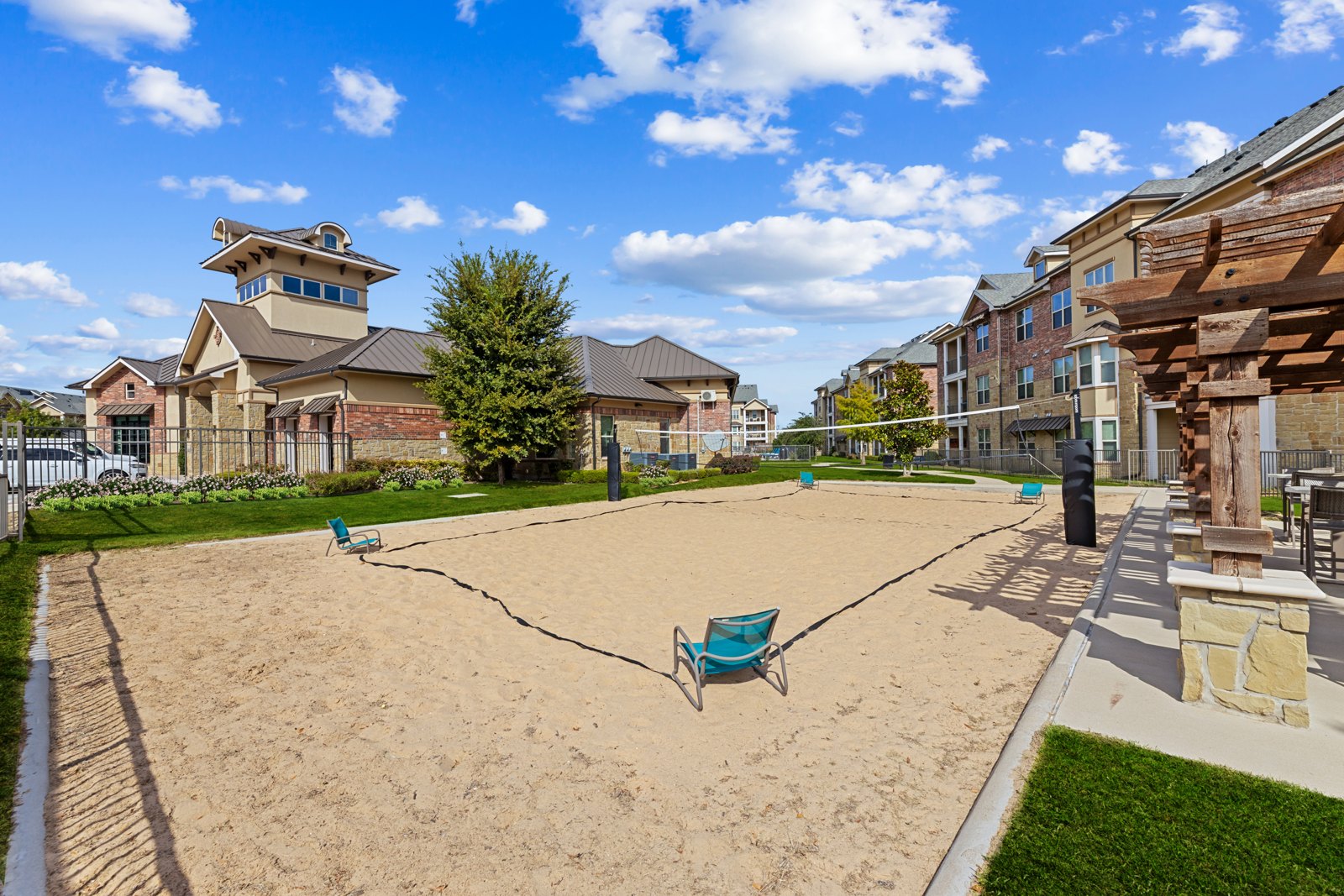 Sand Volleyball area with seating at Auberge of Burleson