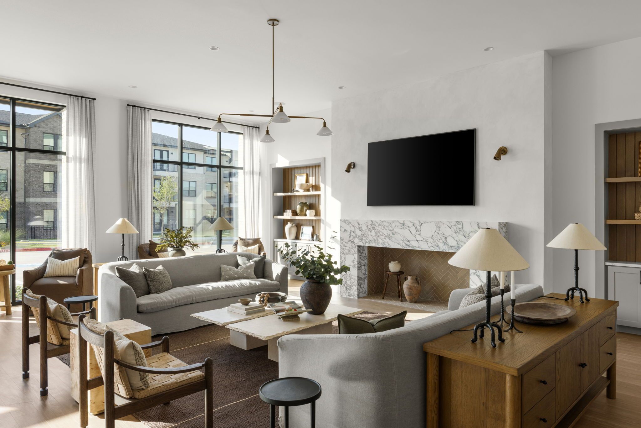 Resident club room with fireplace and lounge seating