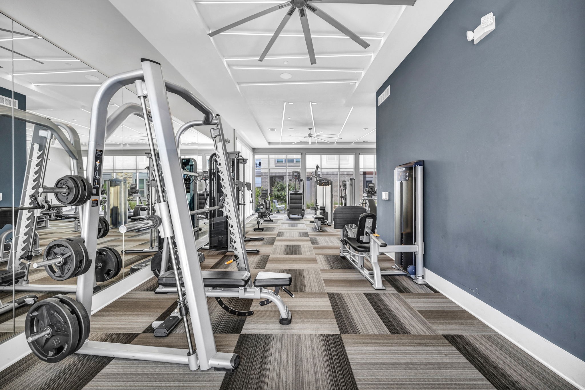 26 at City Point - A gym with a variety of equipment including treadmills, weights, and exercise machines