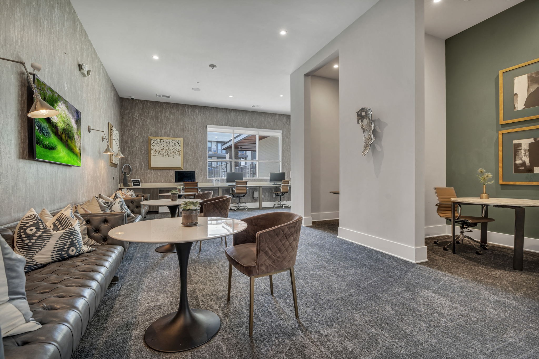 26 at City Point - A modern living room with a grey carpet and a white table