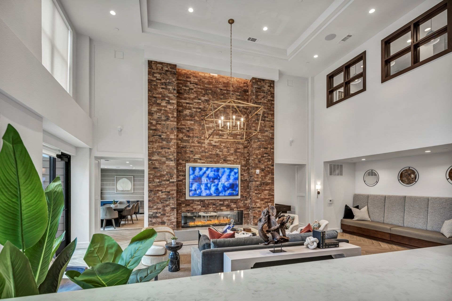 Ablon at Harbor Village - Clubhouse with couches, fireplace and a television