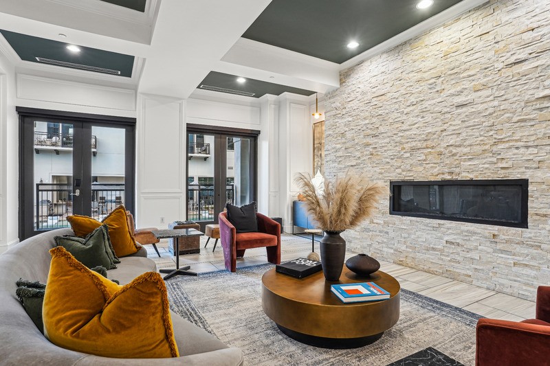 Cantabria at Turtle Creek - Clubroom with stone fireplace and lounge seating