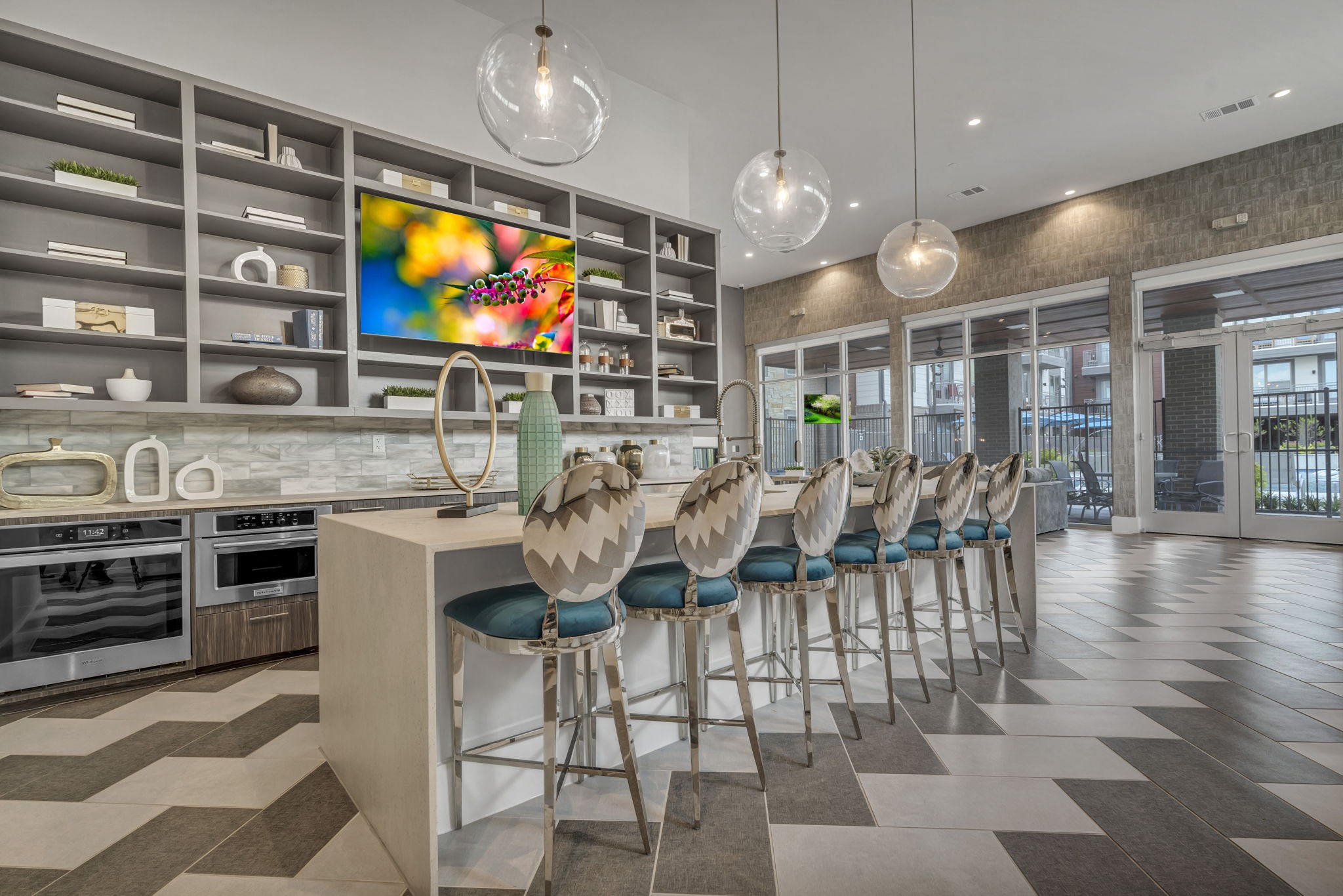 26 at City Point - A modern kitchen with a bar area and a large painting on the wall