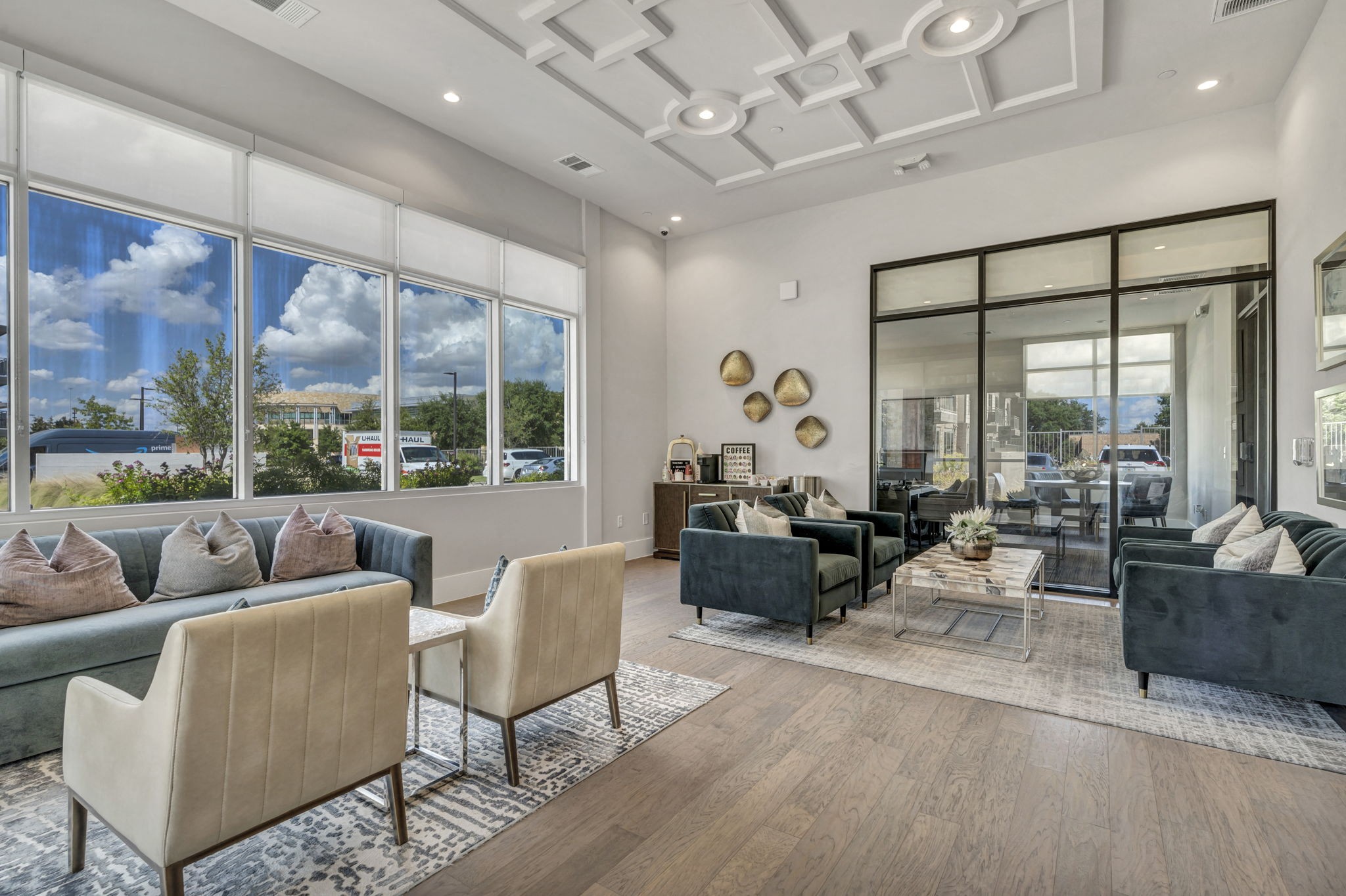 26 at City Point - A modern living room with a large window and a view of the outdoors