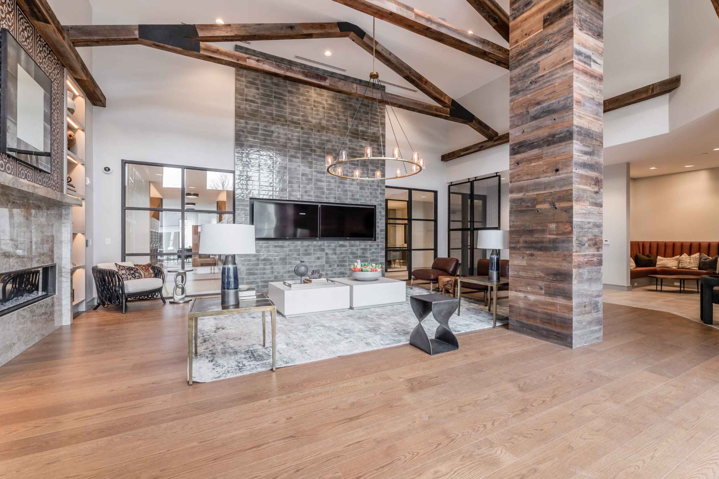 Atlas Crown - Community lounge area with a fireplace and televisions