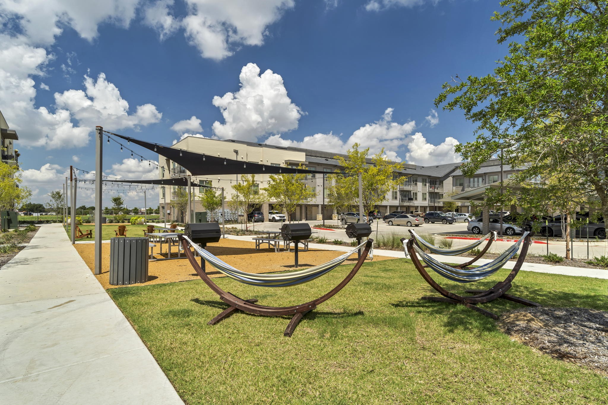 26 at City Point - A park with a hammock and a building in the background