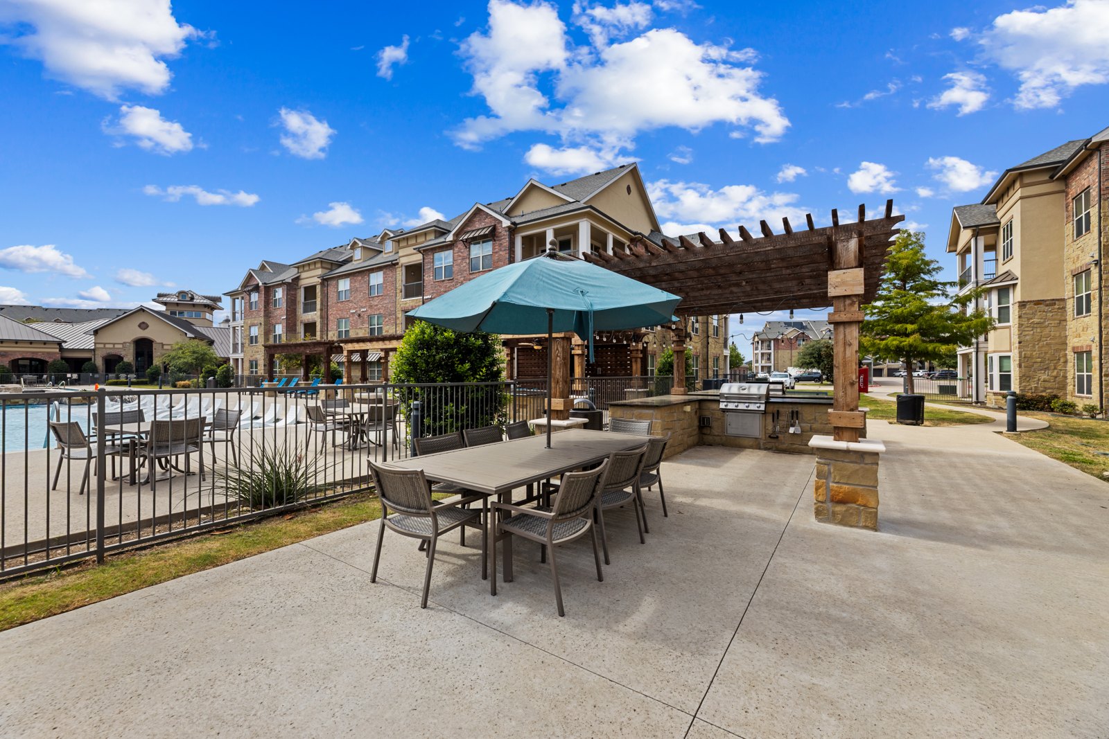 Poolside patio seating area at Auberge of Burleson