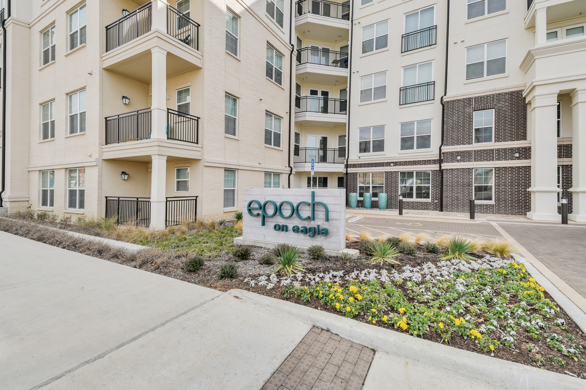 Property signage and building exterior at Epoch on Eagle