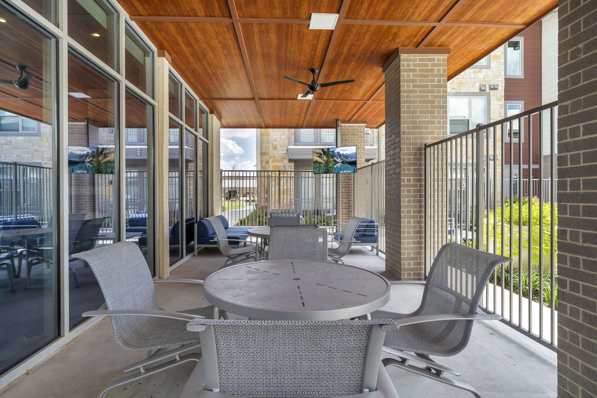 26 at City Point - A patio with a table and chairs is shown