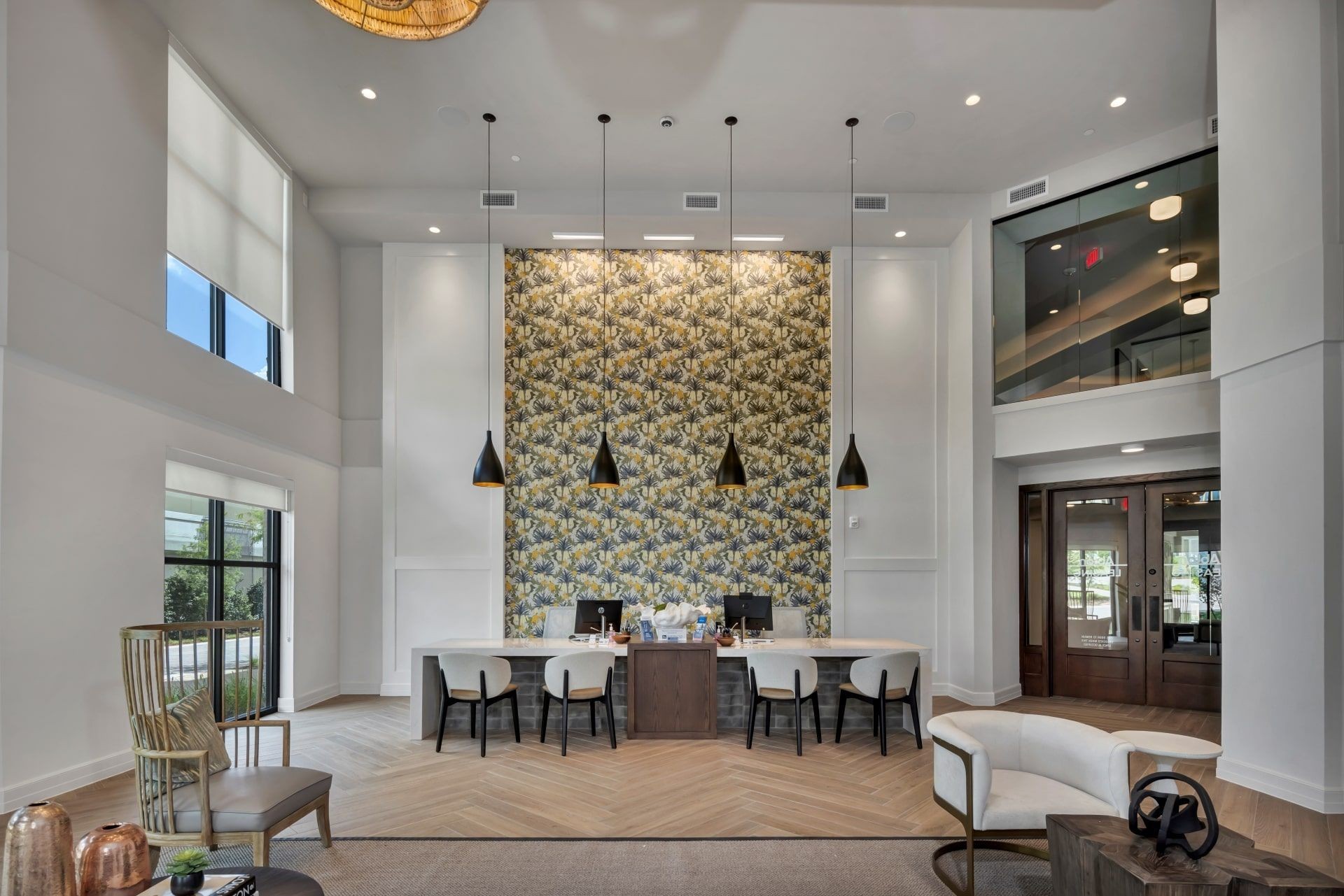 Ablon at Harbor Village - Leasing center with a long desk, tables and chairs