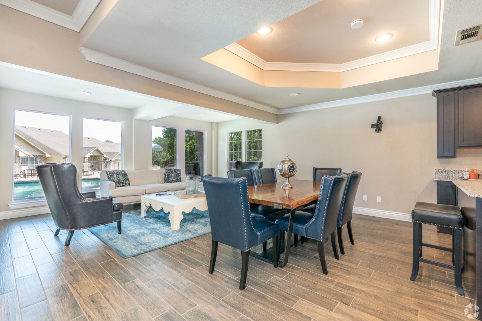 A dining room with a table and chairs. at Ash Lane Apartment Homes