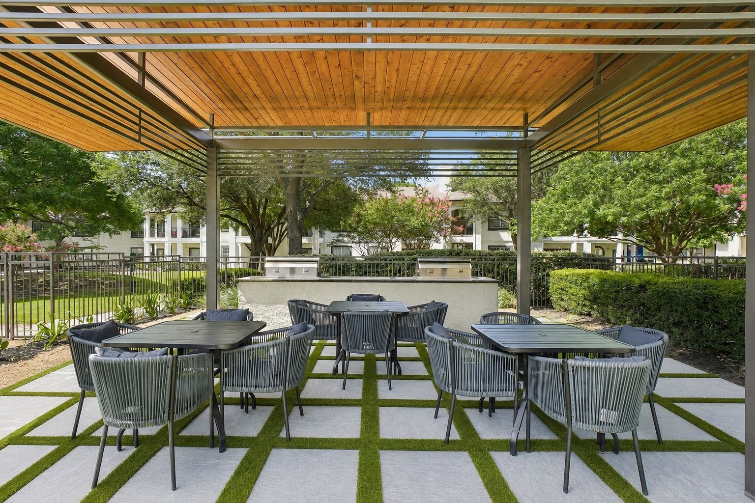 23Hundred at Ridgeview - A cozy outdoor dining area with tables and chairs under a wooden canopy