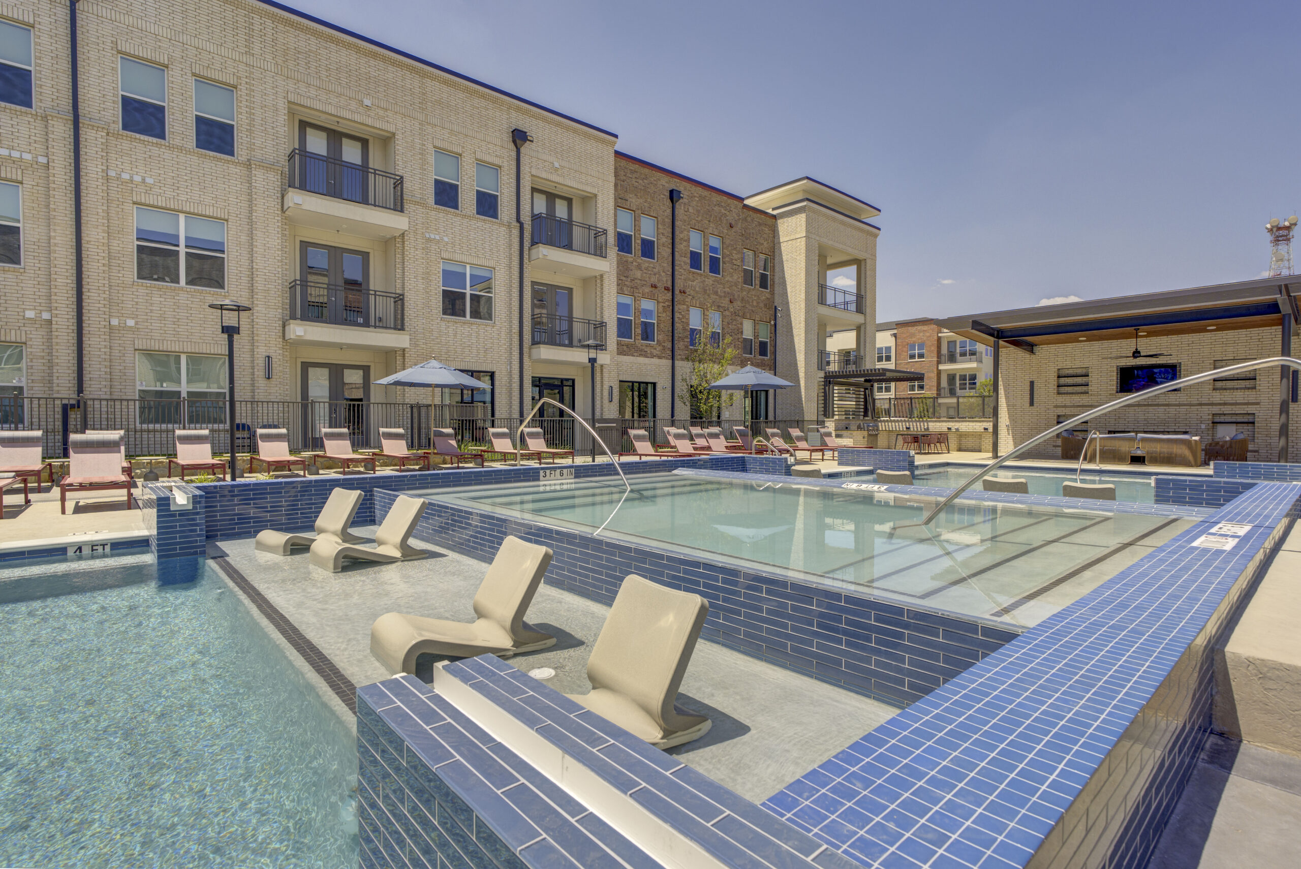 Resort-Style Pool with Sun Ledge at Village at Lexington Ranch