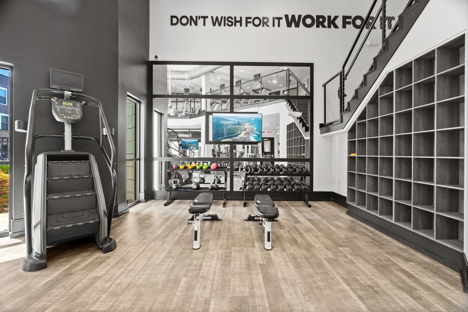 A gym with a sign th at Axis at Watters Creek