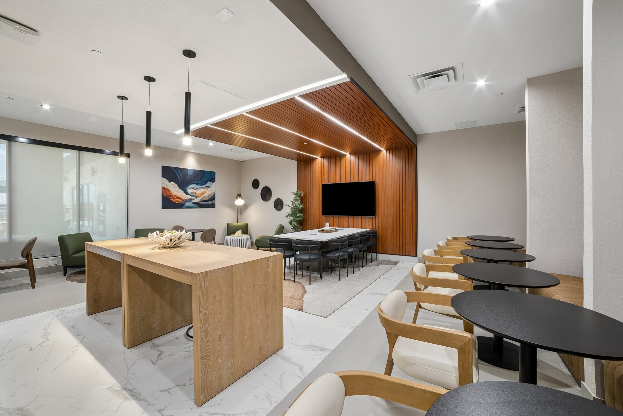 Clubhouse with work tables and lounge seating