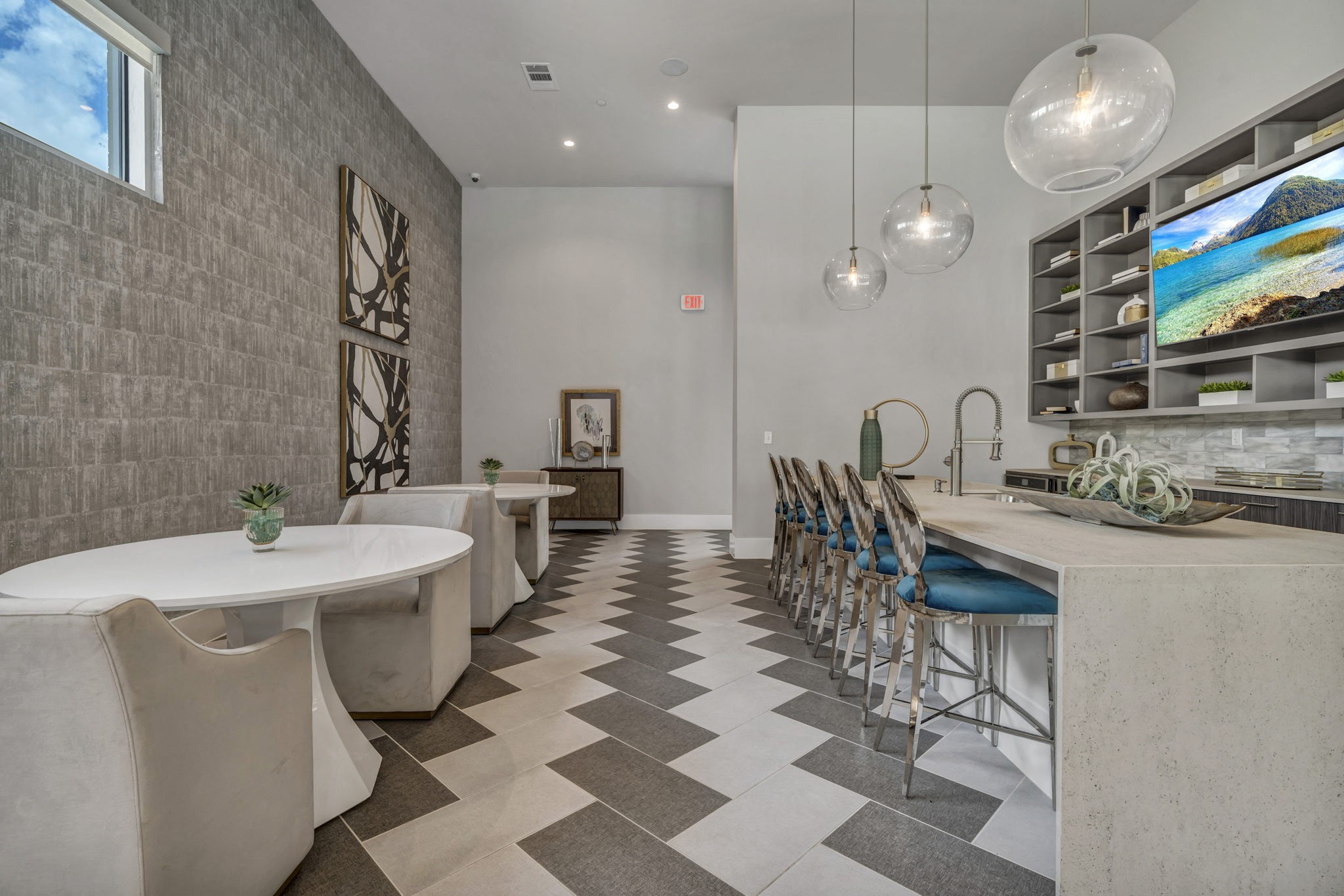 26 at City Point - A modern dining room with a long table and chairs