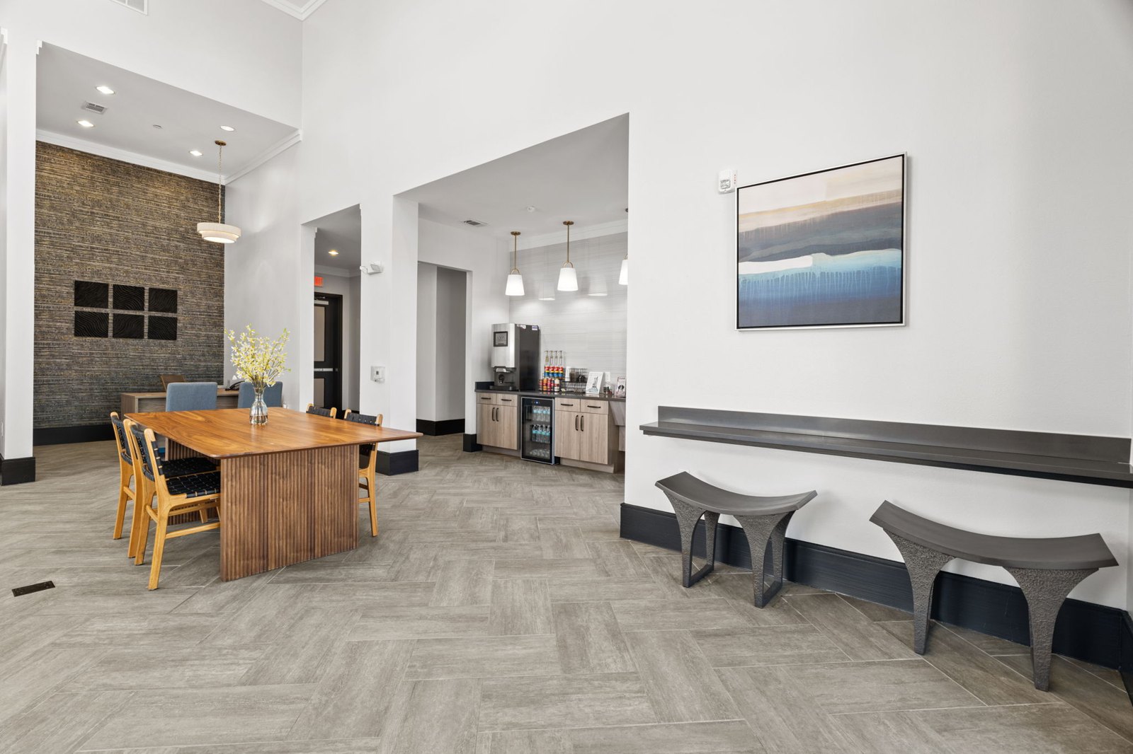 A modern dining room with a wooden table and chairs. at Axis at Watters Creek