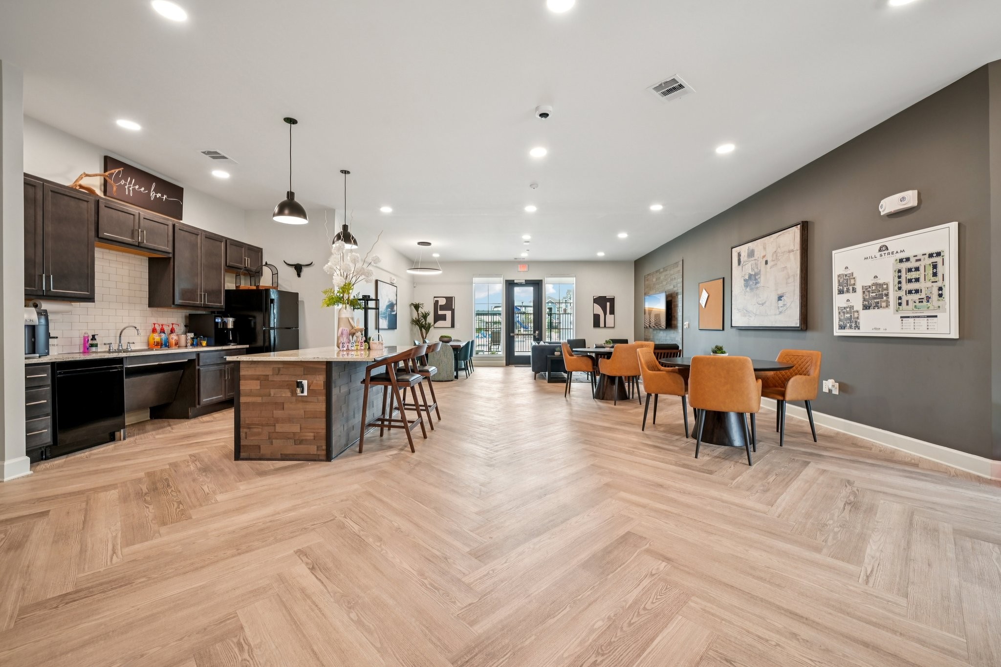 Clubhouse lounge with kitchen and seating