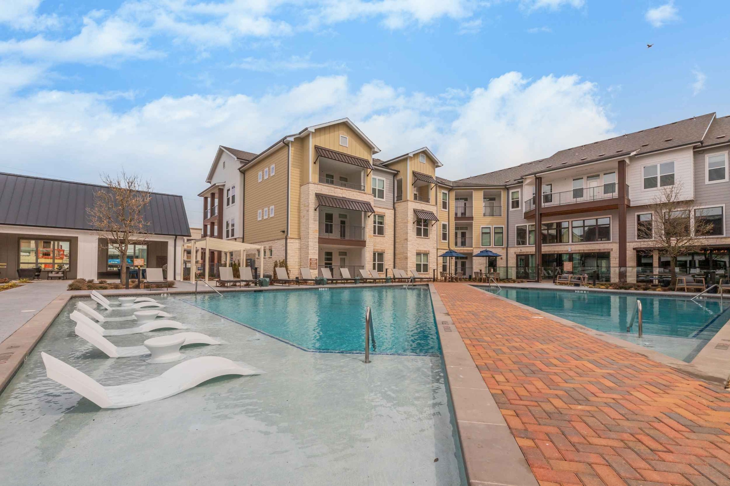 Atlas Crown - Swimming pool and sundeck with lounge chairs