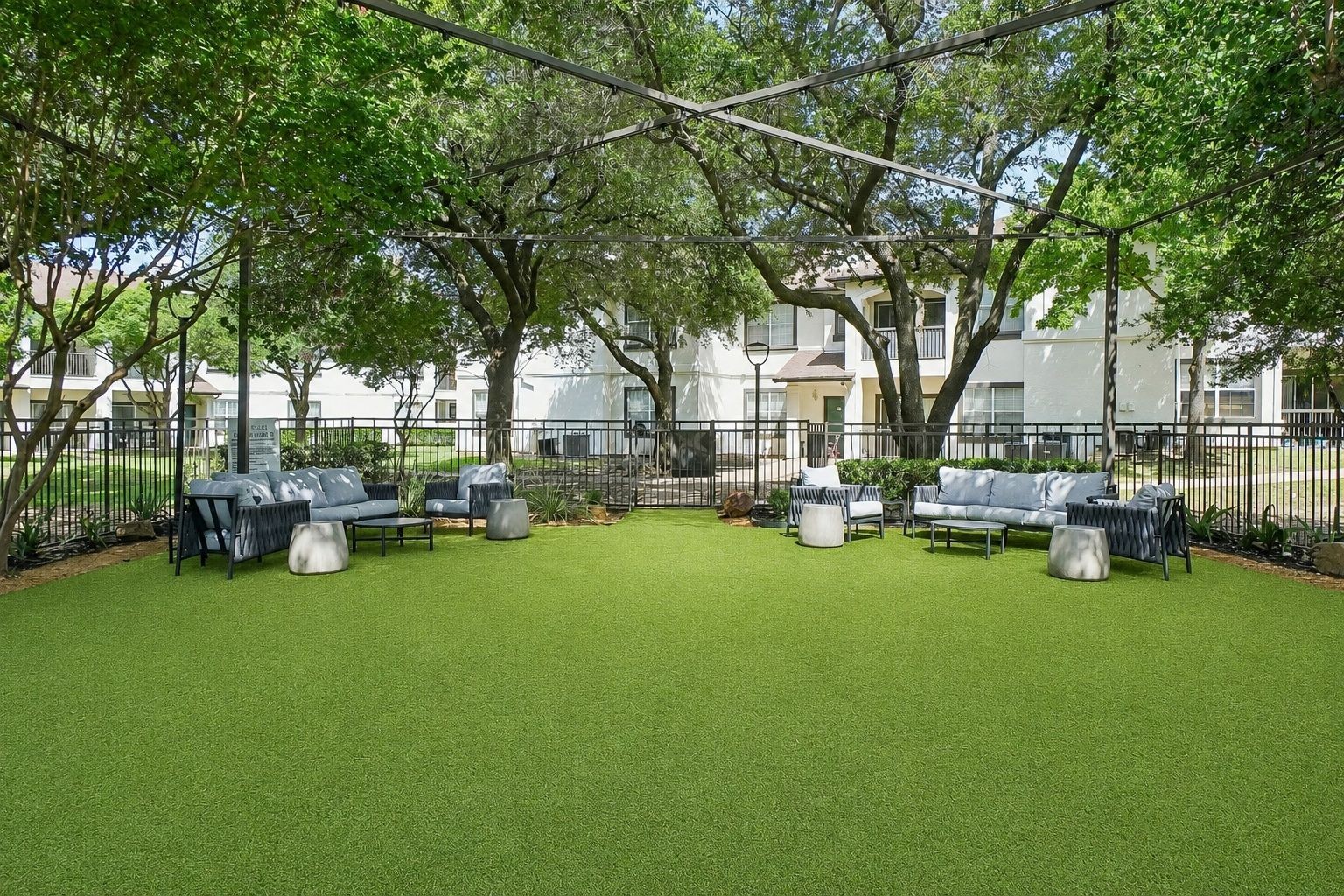 23Hundred at Ridgeview - A stylish outdoor space with comfortable seating and a lush green lawn