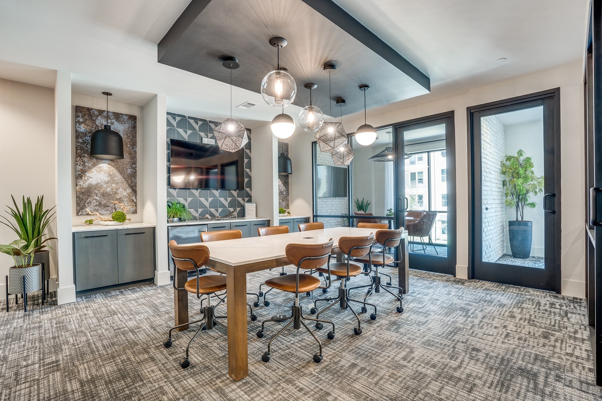 a conference room with a long table and chairs