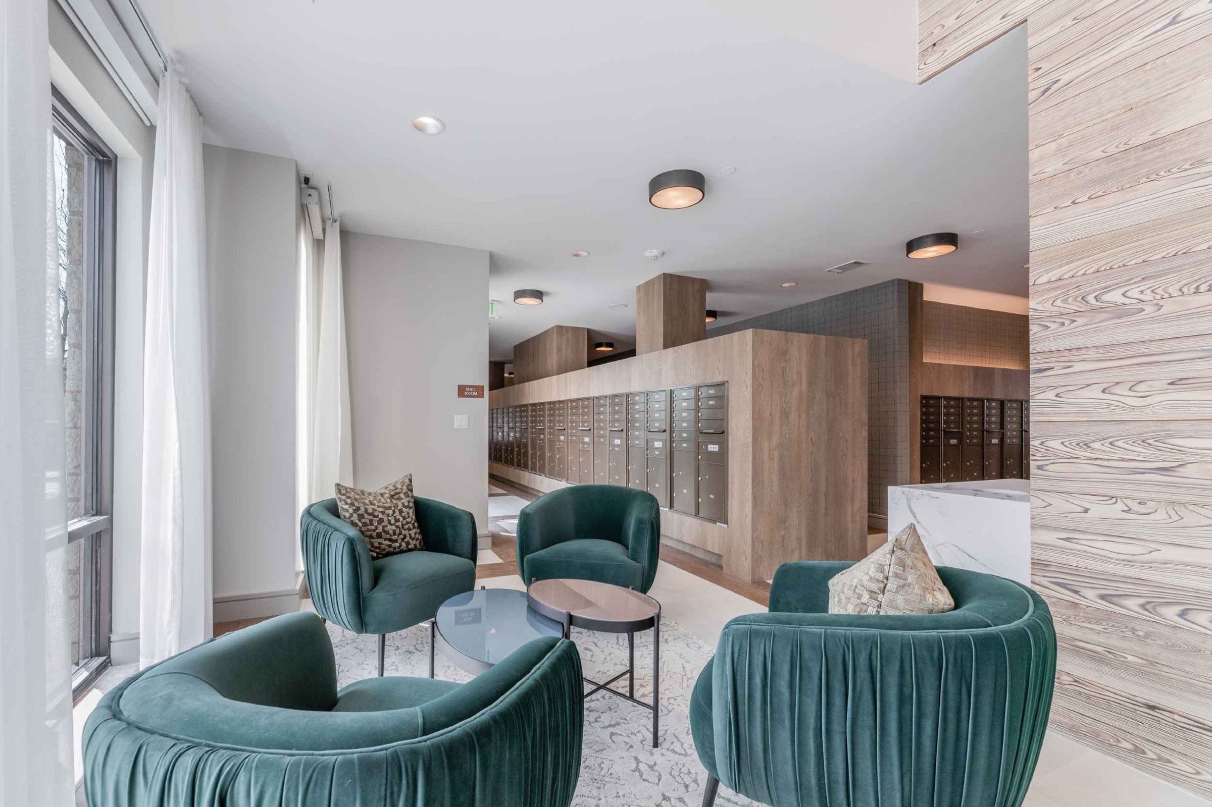 Atlas Crown - Mailroom and lounge area with modern chairs